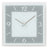 Horloge murale AMS avec cadran bleu-gris, aiguilles argentées et cadre carré en verre