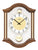 Horloge murale avec boîtier en bois de noyer, cadran rond et balancier doré