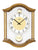 Horloge murale avec boîtier rond en bois massif couleur chêne et vitre en verre
