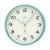 Horloge murale ronde avec cadre turquoise, cadran crème et aiguilles noires, AMS
