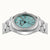 Runde Edelstahl-Uhr mit türkisfarbenem Zifferblatt und Metallarmband