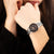Festina Armbanduhr am Handgelenk, schwarzes Zifferblatt, silbernes Keramikband