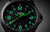 Montre Traser pour homme avec cadran sombre et index et aiguilles luminescents verts