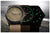 Deux montres-bracelets côte à côte, bracelets en tissu marron, cadrans avec luminescence verte