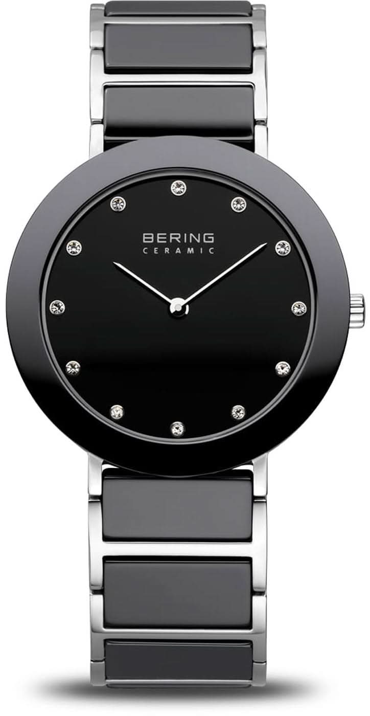 Montre pour femme avec cadran noir, index et lunette en céramique sur bracelet en acier inoxydable.