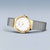 Bering Damenuhr mit goldfarbenem Gehäuse, weißem Zifferblatt und silbernem Milanese-Armband