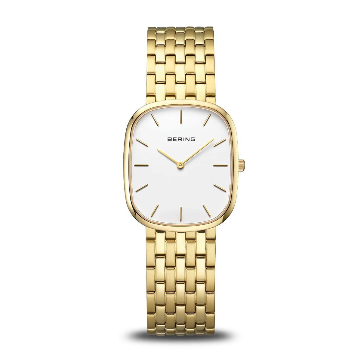 Montre pour femme dorée avec cadran rectangulaire arrondi et bracelet en métal.