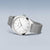 Bering montre avec boîtier rond argenté, cadran blanc et bracelet milanais argenté