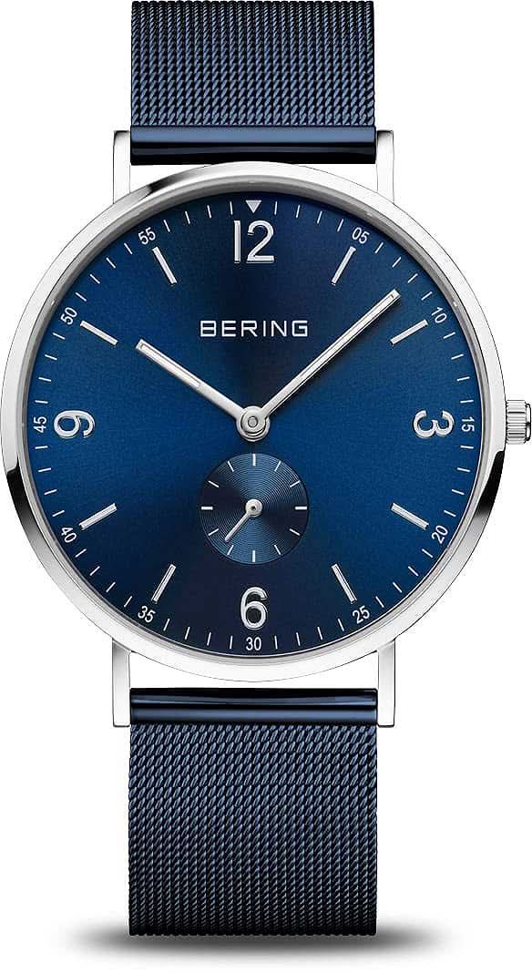 Bering Montre Homme avec cadran bleu, index blancs et bracelet milanais bleu