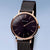 Bering Damenuhr mit schwarzem Zifferblatt, Roségold-Lünette und schwarzem Milanaise-Armband