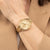 Damenarmbanduhr BOSS Sage Sport goldfarben am Handgelenk mit Metallarmband
