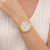 Goldfarbene Damen-Armbanduhr mit Metallband und weißem Chronographenzifferblatt