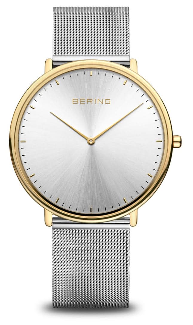 Montre homme avec cadran blanc, boîtier doré et bracelet milanais argenté.