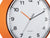 Cadran de montre Karlsson avec bordure orange vif, aiguilles orange et noires.