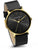 Montre bracelet pour homme de profil : cadran noir, boîtier doré, bracelet en cuir noir