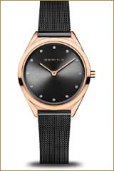 Montre pour femme avec cadran noir et boîtier or rose, bracelet milanais en métal