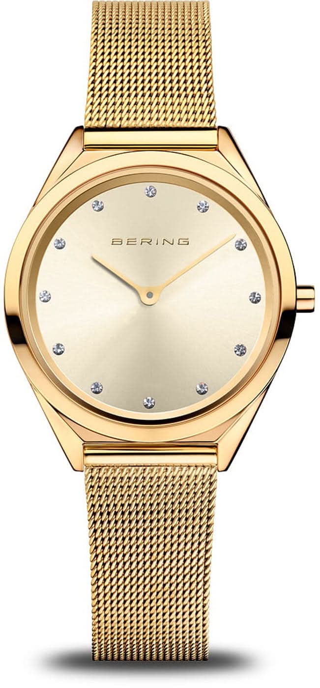 Montre Bering pour femme avec cadran beige, lunette dorée et bracelet milanais