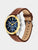 Herrenuhr mit blauem Zifferblatt, goldfarbener Lünette und braunem Lederarmband