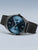 Herren-Uhr mit blauem Zifferblatt, schwarzem Milanaise-Armband und Krone am Gehäuserand