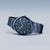 Bering montre homme de côté : cadran bleu foncé avec index et bracelet en maille métallique