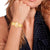 Tommy Hilfiger MOIRA Damenarmbanduhr in Gold mit Mesh-Armband und ovalem Zifferblatt