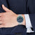 Tommy Hilfiger Herrenarmbanduhr: blaues Zifferblatt, grüne Lünette, Stahlband