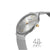 Schmale Damenuhr in Silber mit Milanaise-Armband, goldene Krone und Stabindizes