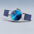 Damenuhr mit blauem Milanaise-Armband und rundem Gehäuse; Zeiger auf blauem Zifferblatt