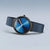 Damenuhr mit rundem blauem Zifferblatt, schwarzem Gehäuse und blauem Mesh-Milanese-Armband