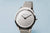 Bering Damenuhr mit silbernem Zifferblatt, schlanker Rundgehäuseform und Milanaise-Armband