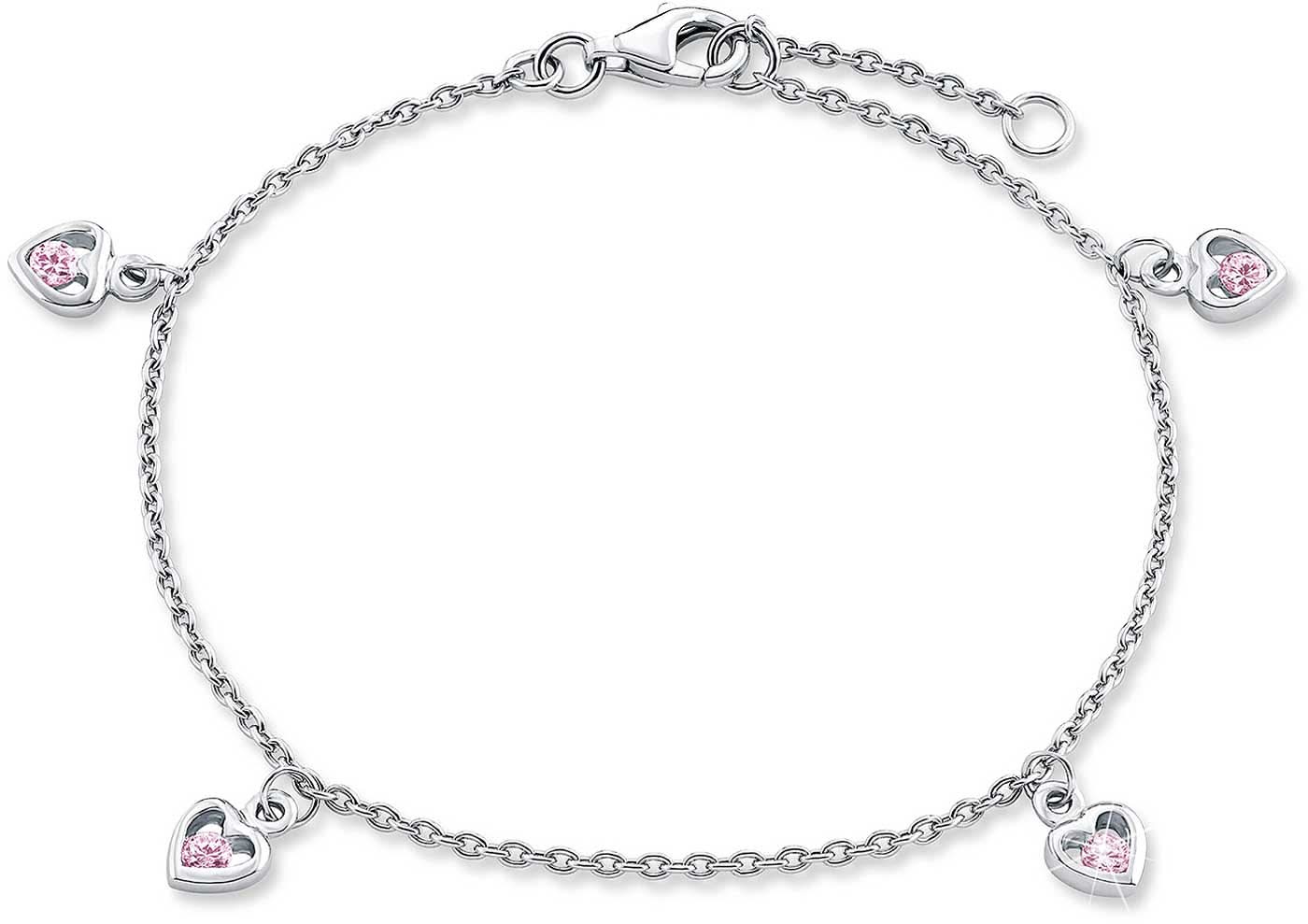 Bracelet jonc argenté avec quatre breloques cœur et des accents roses