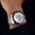 Montre chronographe pour homme au poignet, lunette en céramique noire, bracelet en acier inoxydable