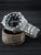 Herrenarmbanduhr Lorus mit silbernem Edelstahlarmband und schwarzem Zifferblatt