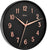 Horloge murale ronde avec cadran noir et aiguilles en or rose ; bordure noire