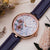 Holzkern Damenuhr mit violettem Armband und roségoldfarbenem Gehäuse; florales, helles Zifferblatt