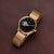 Holzkern Unisex-Armbanduhr mit schwarzem Zifferblatt und goldfarbenem Meshband