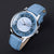 Unisex-Armbanduhr mit blauem Lederarmband; blaues, marmoriertes Zifferblatt mit Wassertribe-Motiv