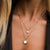 Collier plaqué or avec pendentif cercle en nacre et petit motif cercle