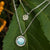 Collier en argent avec grand pendentif rond en nacre et petit charm scintillant