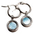 Boucles d'oreilles créoles argentées avec pendentif rond et pierre bleue