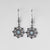 Boucles d'oreilles argentées avec flocon de neige délicat et pierre décorative bleue