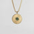 Collier en or avec pendentif rond et pierre verte