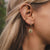 Boucles d'oreilles à l'oreille : petite créole dorée avec pendentif rond et pierre verte