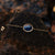 Bracelet gourmette doré avec pendentif ovale en cabochon bleu