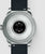 Arrière de la montre connectée : boîtier rond avec zone de contact noire et bracelet noir