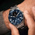 Montre connectée Withings Nova au poignet, bracelet en acier inoxydable, cadran bleu foncé avec ECG