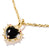 Pendentif cœur avec cœur noir et passant doré sur la chaîne, zirconias et accents.