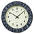 Horloge murale ronde : cadran beige, chiffres/aiguilles noirs, aspect pierre anthracite-noir.