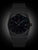 Montre Ruhla pour femme, cadran noir avec index bleus, date 25