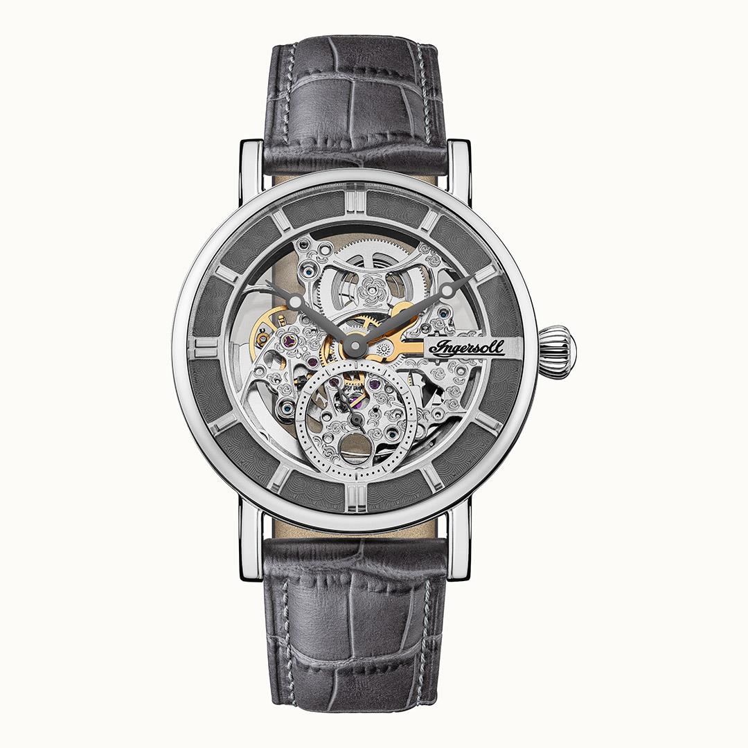 Silberfarbene Herrenuhr mit skelettiertem Zifferblatt und dunkelgrauem Lederarmband